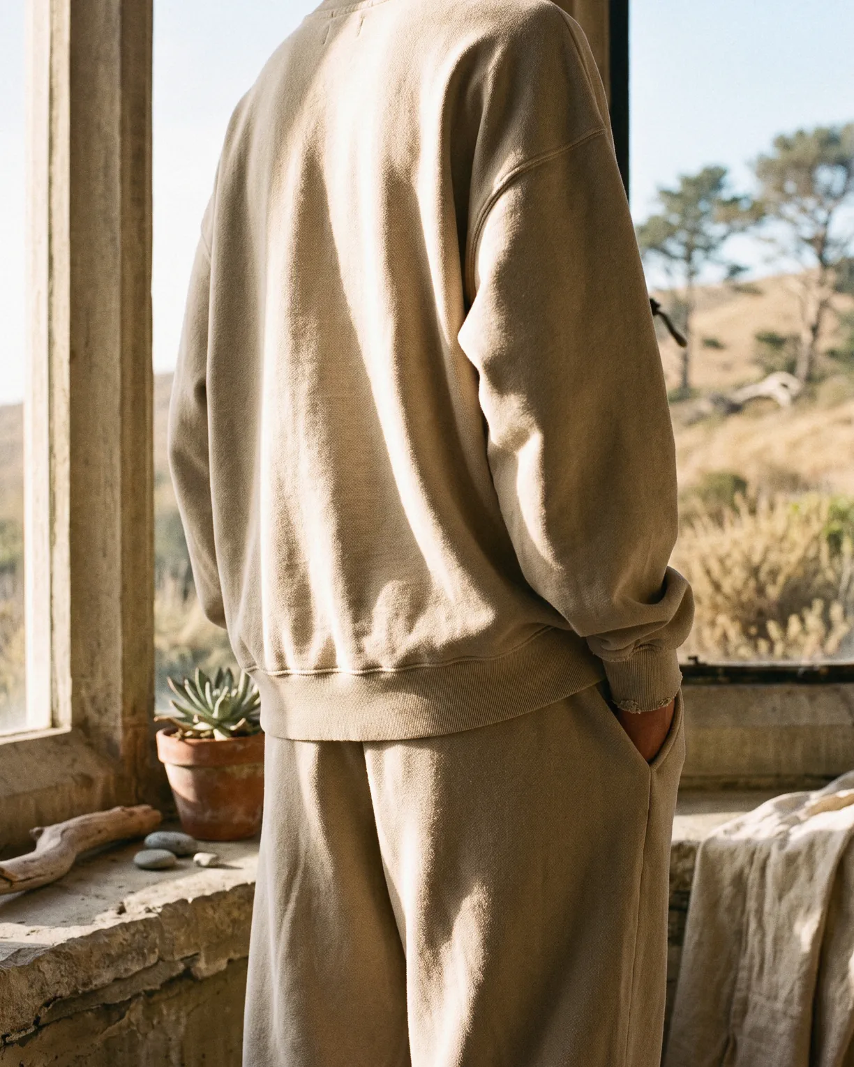 the after set in oat brushed cotton, worn at an open window