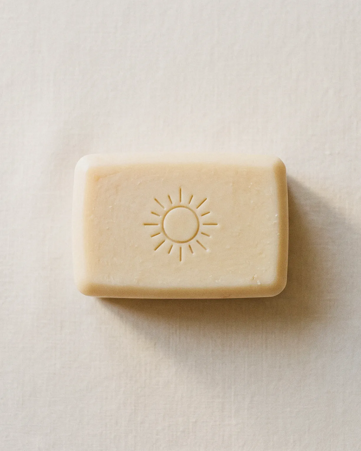 the sun bar, cream soap pressed with a sun